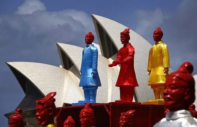 An art installation called the “Lanterns of the Terracotta Warriors” stands in front of the Sydney Opera House February 19, 2015. (Photo by David Gray/Reuters)