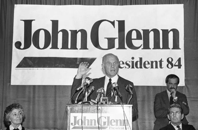 In this Tuesday, January 18, 1984 file photo, Sen. John Glenn, D-Ohio, answers questions from the press in Jackson, Miss. At left is his wife, Annie Glenn. Glenn travelled through the South seeking support for his presidential campaign. (Photo by Tannen Maury/AP Photo)