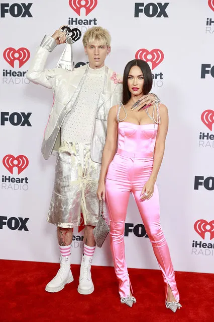 (L-R) Machine Gun Kelly, winner of the Alternative Rock Album of the Year award for 'Tickets To My Downfall,’ and Megan Fox attend the 2021 iHeartRadio Music Awards at The Dolby Theatre in Los Angeles, California, which was broadcast live on FOX on May 27, 2021. (Photo by Emma McIntyre/Getty Images for iHeartMedia)