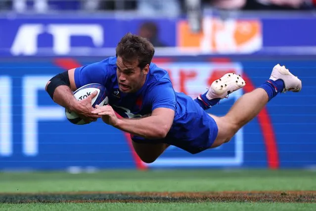 France's wing Damian Penaud dives across the line to score a try during the pre-World Cup rugby union international Test match between France and Australia at Stade de France in Saint Denis, on the outskirts of Paris on August 27, 2023. (Photo by Franck Fife/AFP Photo)