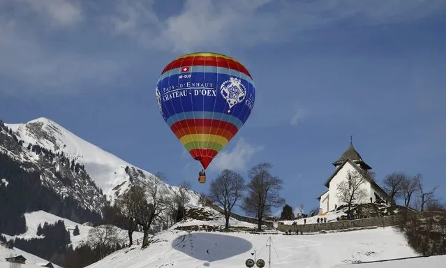 A balloon flies during the 38th International Hot Air Balloon Week in Chateau-d'Oex, Switzerland January 23, 2016. (Photo by Denis Balibouse/Reuters)