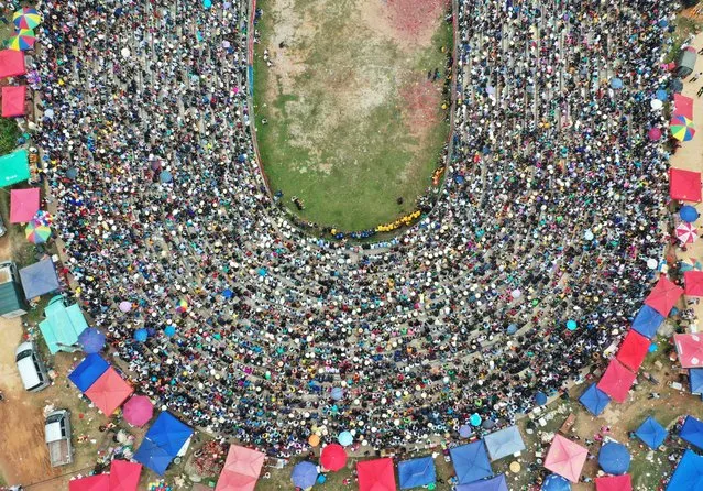 This aerial photo taken on September 26, 2023 shows spectators attending a bullfight in Congjiang county, in China's southwestern Guizhou province. (Photo by AFP Photo/China Stringer Network)