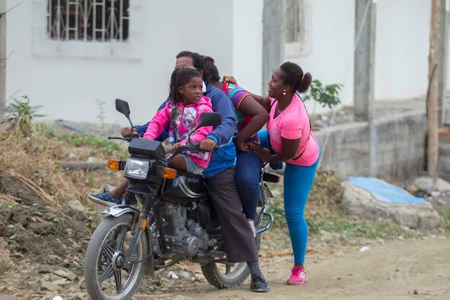 A family rides on a motorcycle in Monte Sinai, a neighborhood in Guayaquil, Ecuador December 18, 2016. (Photo by Guillermo Granja/Reuters)