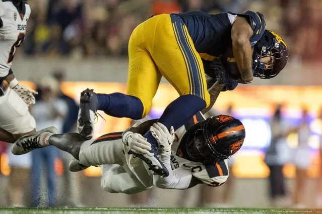 California Golden Bears running back Jaydn Ott (1) is tackled by Oregon State Beavers defensive back Kitan Oladapo (28) during the second quarter at California Memorial Stadium in Berkeley, California on October 7, 2023. (Photo by Kyle Terada/USA TODAY Sports)