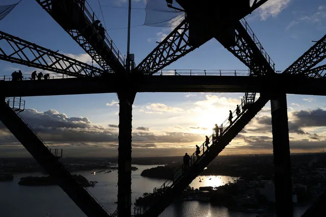 People climb the Sydney Harbour Bridge on a guided excursion in Sydney, Australia, June 22, 2021. (Photo by Loren Elliott/Reuters)