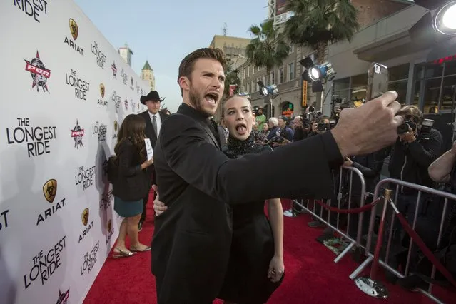 Cast members Scott Eastwood and Britt Robertson take a selfie at the premiere of “The Longest Ride” at the TCL Chinese theatre in Hollywood, California April 6, 2015. (Photo by Mario Anzuoni/Reuters)