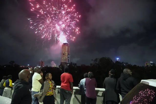 Fireworks explode over the city during New Year's celebrations in Nairobi, Kenya, Monday, January 1, 2024. (Photo by Sayyid Abdul Azim/AP Photo)