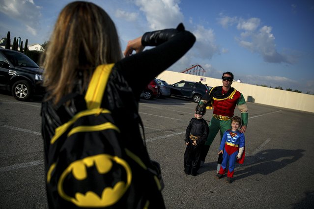 Participants wearing superhero costumes have their picture taken before the World DC Comics Super Heroes event in San Martin de Valdeiglesias, near Madrid, April 18, 2015. (Photo by Andrea Comas/Reuters)