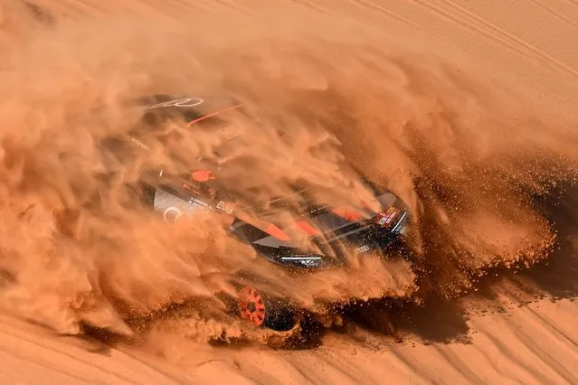 Team Audi Sport's Swedish driver Mattias Ekstrom and his Swedish co-driver Emil Bergkvist steer their car in the dunes during the stage 8 of the 2024 Dakar Rally, between Al Duwadimi and Hail, Saudi Arabia, on January 15, 2024. (Photo by Patrick Hertzog/AFP Photo)