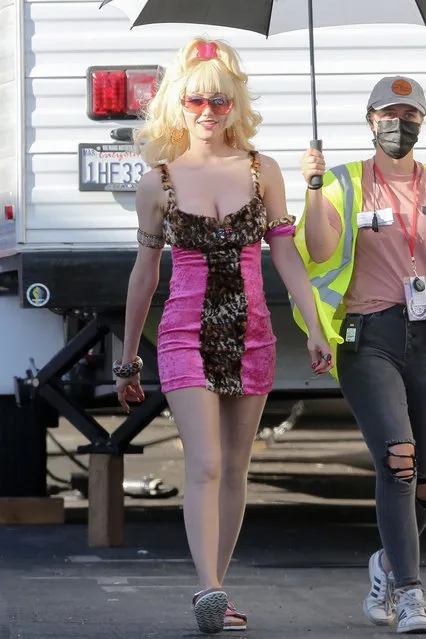 Actress Emmy Rossum slips into a pink form-fitting dress once again to film reshoots for the mini tv series “Angelyne” in Los Angeles on September 30, 2021. (Photo by W. Blanco/Backgrid USA)