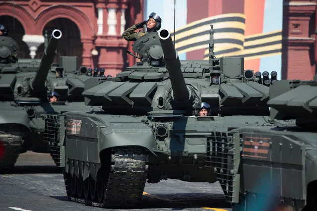 Russian T-72B3 tanks move along Red Square during a rehearsal for the Victory Day military parade in Moscow, Russia, Tuesday, May 7, 2019. The parade will take place at Moscow's Red Square on May 9 to celebrate 74 years of the victory in WWII. (Photo by Pavel Golovkin/AP Photo)