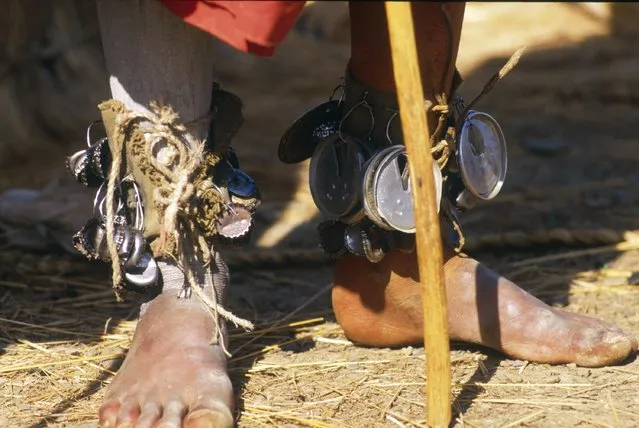 Pictured here are the feet of a Sangoma, adorned with little bells. In a surprising mix of tradition and modernism, they are actually made of soda cans tops and bottle caps. (Photo by Patrick Durand/Sygma via Getty Images)