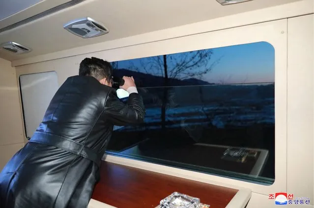 This picture taken on January 11, 2022 and released from North Korea's official Korean Central News Agency (KCNA) on January 12, 2022 shows North Korean leader Kim Jong Un observing what state media says a hypersonic missile test-fire conducted by the Academy of Defence Science of the DPRK at an undisclosed location in North Korea. (Photo by KCNA via KNS/AFP Photo)