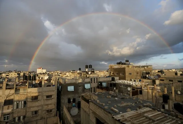 A rainbow is seen over houses in Khan Younis in the southern Gaza Strip, February 10, 2016. (Photo by Ibraheem Abu Mustafa/Reuters)