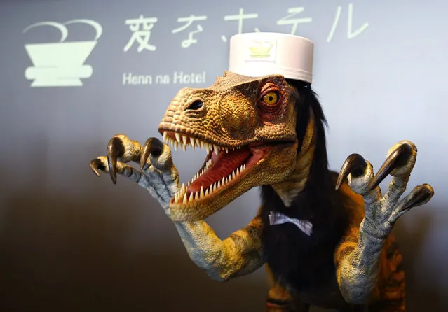 A receptionist dinosaur robot performs at the new robot hotel, aptly called Henn na Hotel or Weird Hotel, in Sasebo, southwestern Japan, Wednesday, July 15, 2015. From the receptionist that does the check-in and check-out to the porter that’s a stand-on-wheels taking luggage up to the room, the hotel, that is run as part of Huis Ten Bosch amusement park, is “manned” almost totally by robots to save labor costs. (Photo by Shizuo Kambayashi/AP Photo)