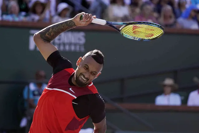 Nick Kyrgios, of Australia, tosses his racket after losing a point to Rafael Nadal, of Spain, during a quarterfinal in the BNP Paribas Open tennis tournament Thursday, March 17, 2022, in Indian Wells, Calif. (Photo by Mark J. Terrill/AP Photo)