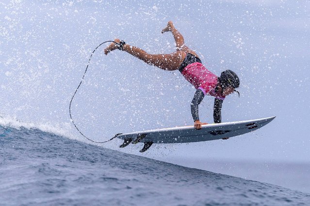 Nearly 10,000 miles from the rest of the Olympics, Sol Aguirre, from Peru, competes in the women’s surfing first round in Teahupo’o, Tahiti on July 27, 2024. (Photo by Ed Sloane/Reuters)