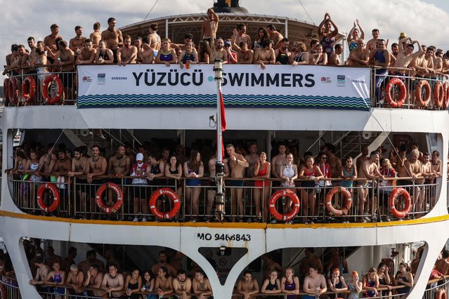 Competitors ride a ferry at the Bosphorus before the Turkish Olympic Committee's (TOC) 36th Samsung Bosphorus Cross-Continental Swimming Race, in Istanbul, Turkey, 25 August 2024. The race starts on the Asian side of Istanbul (the Anatolian side) at the harbor of the Kanlica district and finishes in the Kurucesme district on the European side. The average time required to finish the race is 50 minutes to swim 6.5 kilometers. (Photo by Erdem Şahin/EPA/EFE)