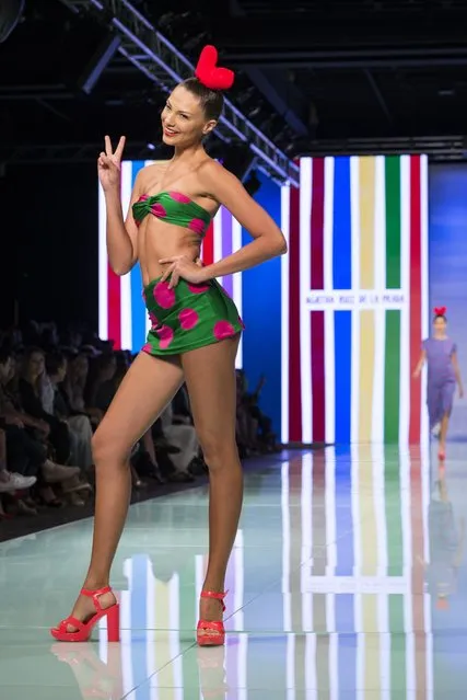 In this Sunday, June 4, 2017 photo, a model walks the runway wearing a design by Agatha Ruiz de la Parada on the final day of Miami Fashion Week at Ice Palace Film Studios in Miami. (Photo by Bryan Cereijo/Miami Herald via AP Photo)