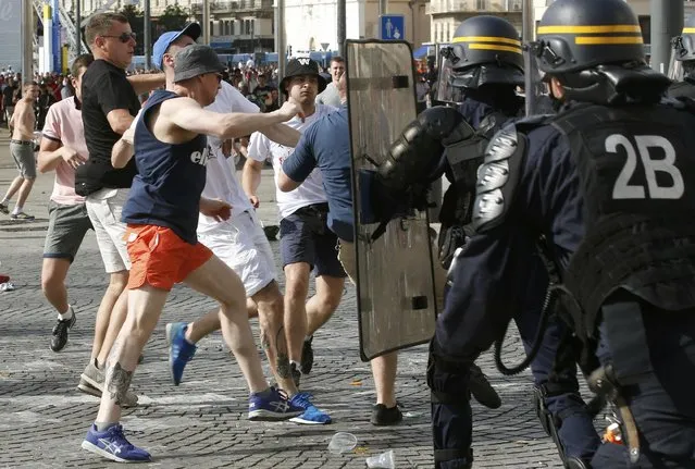 Football Soccer, Euro 2016, England vs Russia, Group B, Stade Velodrome, Marseille, France on June 11, 2016. Police and supporters clash at the old port of Marseille before the game. (Photo by Jean-Paul Pelissier/Reuters)
