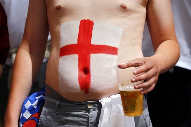 Football Soccer, EURO 2016, Saint Etienne, France on June 20, 2016. An England fan holds a beer in Saint Etienne, France. (Photo by Wolfgang Rattay/Reuters)