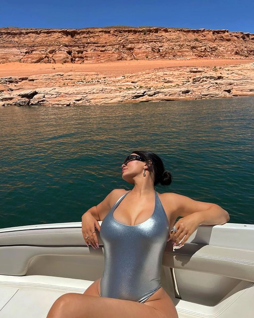 American social media personality and model Kylie Jenner enjoys lake life in a metallic swimsuit early June 2022. (Photo by kyliejenner/Instagram)