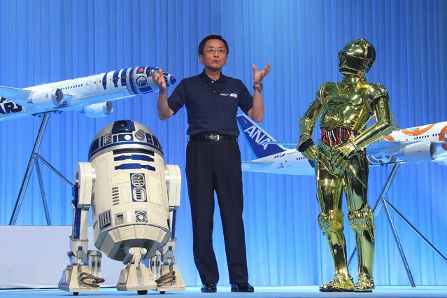 Japan's All Nippon Airways presents three designs for its Star Wars-themed airplanes during a press conference in Tokyo, Japan on August 18, 2015. ANA, which signed a five-year promotion license contract with the Walt Disney Co. last April, said that the Star Wars flights will feature the movie characters also in the headrest covers, napkins, cups and in-flight decorations. (Photo by Aflo/Splash News)