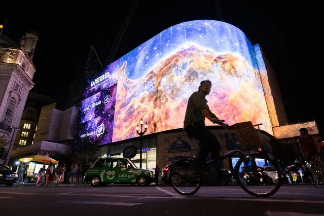 NASA broadcasts the first images from the James Webb Space Telescope, the world's most advanced space telescope on the Piccadilly Lights screen in London on Tuesday, July 12, 2022. Experts say early observations are expected to change the face of astronomy forever. (Photo by James Manning/PA Images via Getty Images)