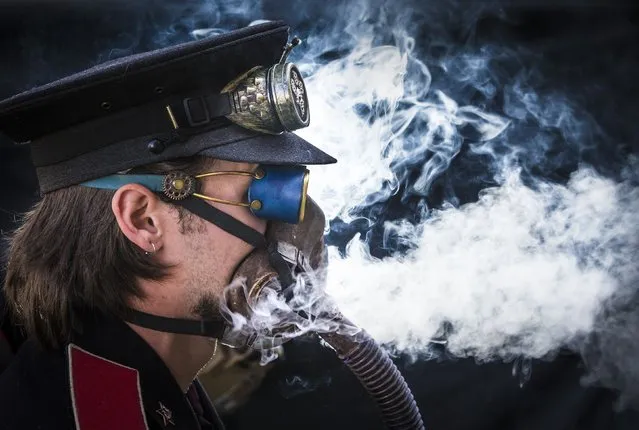 A steampunk attends the Asylum Steampunk Festival, Sunday, August 27, 2017, in Lincoln, central England, claimed to be the largest and longest running steampunk festival in the World. The festival attracts participants from around the globe. For four days the streets of Lincoln are thronged with thousands of steampunks enjoying a festival which strives to combine art, literature, music, fashion and comedy. (Photo by Danny Lawson/PA Ware via AP Photo)