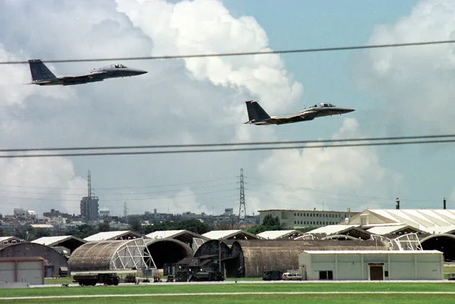 F-15 jet fighters prepare to land during a flight training at Kadena Air Base on the Okinawa island, Japan, on June 26, 1996. Okinawa on Sunday, May 15, 2022, marks the 50th anniversary of its return to Japan on May 15, 1972, which ended 27 years of U.S. rule after one of the bloodiest battles of World War II was fought on the southern Japanese island. (Photo by Itsuo Inouye/AP Photo/File)