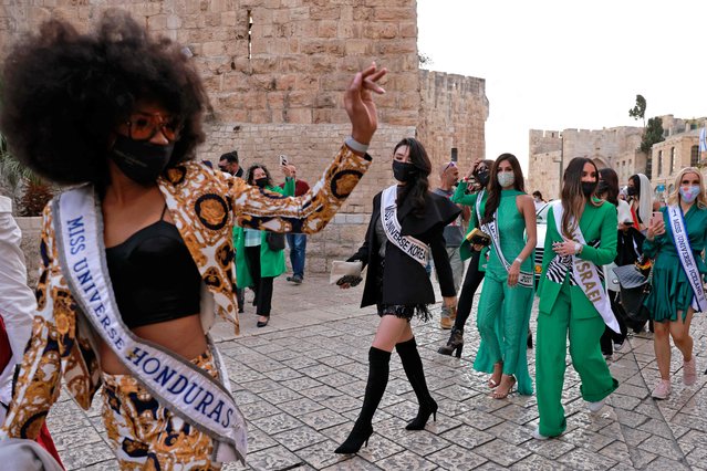 Contestants of the Miss Universe visit the Tower of David Museum in the ancient citadel of Jerusalem near the Jaffa Gate entrance to Jerusalem's Old City, on November 30, 2021. (Photo by Menahem Kahana/AFP Photo)
