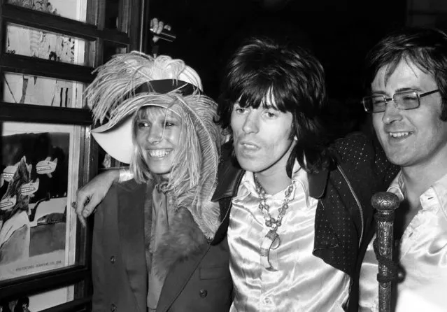 Keith Richards from the Rolling Stones arrives at the premiere of the new Beatles cartoon film Yellow Submarine with Anita Pallenberg at the London Pavillion Cinema, England on July 17, 1968. (Photo by Peter Kemp/AP Photo)