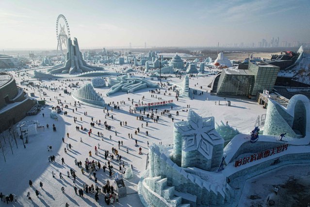 This photo shows an aerial of people visiting the Harbin Ice and Snow World during the 26th Ice Festival in Harbin, in northeastern China's Heilongjiang province on January 5, 2025. (Photo by Jade Gao/AFP Photo)