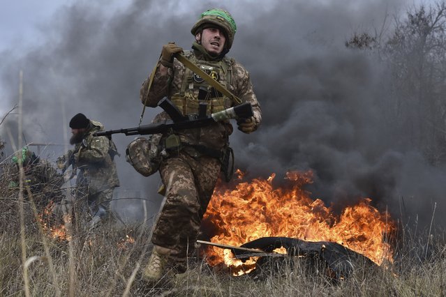 In this photo provided by Ukraine's 65th Mechanised Brigade press service on January 8, 2025, a Ukrainian serviceman trains at the polygon in the Zaporizhzhia region, Ukraine. (Photo by Andriy Andriyenko/Ukraine's 65th Mechanised Brigade Press Service via AP Photo)