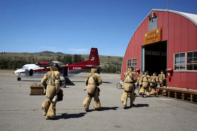 Smokejumper recruits enter the parachute loft during training at the North Cascades Smokejumper Base in Winthrop, Washington, U.S., June 7, 2016. (Photo by David Ryder/Reuters)