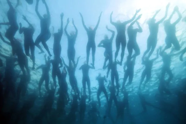 Image taken using an underwater camera. Athletes prepare to compete in the swim portion during the Ironman World Championships on October 06, 2022 in Kailua Kona, Hawaii. (Photo by Tom Pennington/Getty Images for IRONMAN)