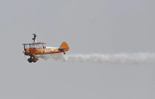 A Breitling Wingwalkers aircraft performs during an aerobatic display at an air show in Zhengzhou, Henan province, China, September 25, 2015. (Photo by Reuters/Stringer)
