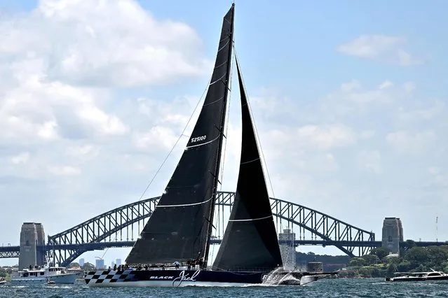 Black Jack competes in the 2022 SOLAS Big Boat Challenge at the harbour in Sydney on December 6, 2022. (Photo by Saeed Khan/AFP Photo)