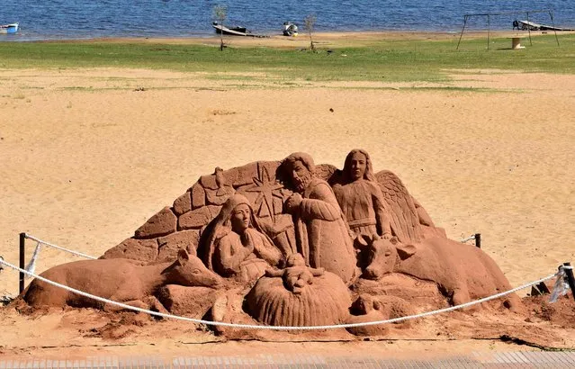 Partial view of a sand nativity scene, by Paraguayan sculptor Oscar Arena, at the Asuncion waterfront, Paraguay on December 22, 2022, during preparations for Christmas celebration. (Photo by Norberto Duarte/AFP Photo)