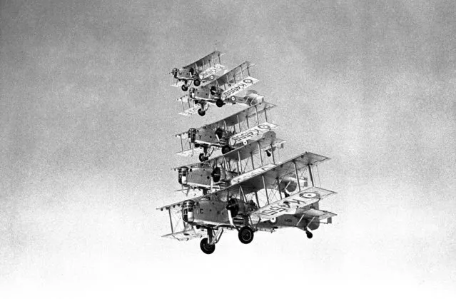 A view of a formation of Overstrand bombing planes, showing the new type of rotating gun turrets which house the machine gunner, in flight over Bicester, Oxfordshire on October 8, 1936. Number 101 bomber squadron of the Royal Air Force has been equipped Woth Boulton and Paul Overstrand bombing planes fitted with Bristol Pegasus twin engines. A feature of these aircraft is the special new rotating gun turrets in the nose of the plane. (Photo by Len Putnam/AP Photo)