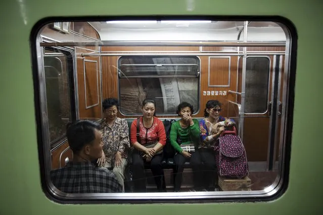 Passengers react inside a train that stopped at a subway station visited by foreign reporters during a government organised tour in Pyongyang, North Korea, October 9, 2015. (Photo by Damir Sagolj/Reuters)
