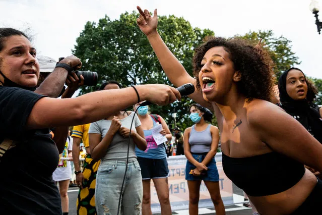 A protester leads a chant during a protest at Black Lives Matter Plaza on August 27, 2020 in Washington, DC. Protesters gathered on the final night of the Republican National Convention in which both President Donald Trump Vice President Mike Pence accepted the Republican nomination as candidates for a second term as U.S. President. (Photo by Natasha Moustache/Getty Images)