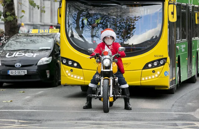 Santa Claus commuting on a motorbike on Dame Street, Dublin, Ireland on December 14, 2022. (Photo by Gareth Chaney/Collins Photos)