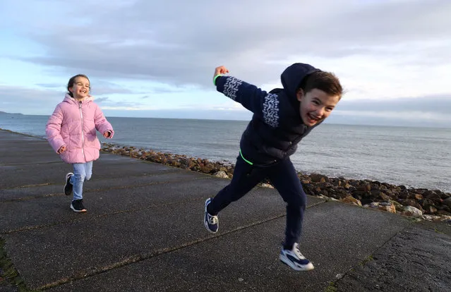 Evie and Conor Enright, from Portmarnock pictured on a walk in Howth, Co. Dublin on December 30, 2022. (Photo by Damien Eagers for The Irish Times)