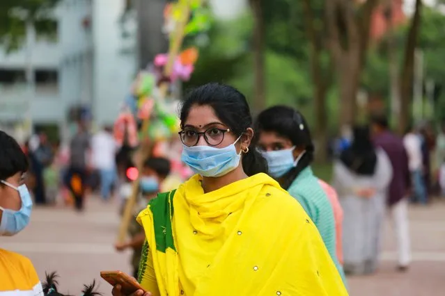 A woman wears face mask as she visiting at the Central Shaheed Minar amid the coronavirus pandemic in Dhaka, Bangladesh on August 28, 2020. (Photo by Rehman Asad/NurPhoto via Getty Images)
