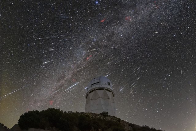 This December 14, 2023 image made available by NOIRLab shows meteors from the Geminid meteor shower streaking across the sky above the Nicholas U. Mayall Telescope at Kitt Peak National Observatory (KPNO), a Program of NSF's NOIRLab, in Tucson, Ariz. (Photo by NSF's NOIRLab via AP Photo)