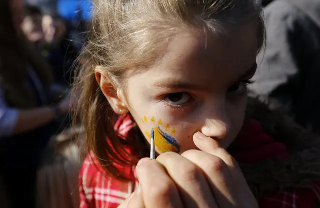 Kosovo flag is being painted on girl's face during celebrations of the 10th anniversary of Kosovo's independence in Pristina, Kosovo February 17, 2018. (Photo by Ognen Teofilovski/Reuters)