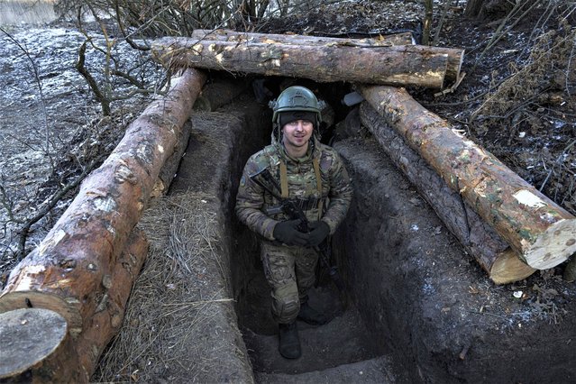 A Ukrainian serviceman stands at his position at the frontline near Bakhmut, Donetsk region, Ukraine, Wednesday, January 11, 2023. (Photo by Evgeniy Maloletka/AP Photo)