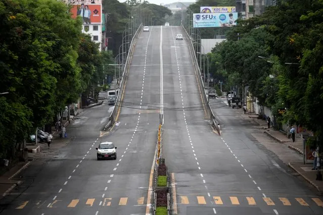 A view of a near-empty road amid the COVID-19 pandemic after authorities announced a stay-at-home order, in downtown Yangon, Myanmar on September 21, 2020. (Photo by Shew Paw Mya Tin/Reuters)