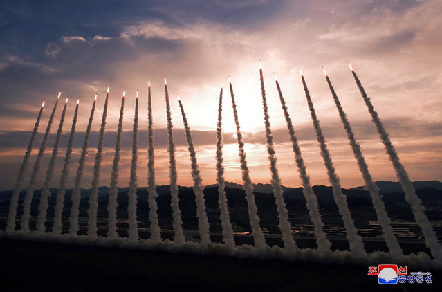This picture taken on May 30, 2024 and released from North Korea's official Korean Central News Agency (KCNA) via KNS on May 31, 2024 shows the test-firing of 600mm super-large rocket artillery at an unconfirmed location in North Korea. North Korean state media on May 31 released images of leader Kim Jong Un supervising tests of a multiple rocket launcher system, a day after Seoul accused Pyongyang of firing a volley of short-range ballistic missiles. (Photo by KCNA via KNS/AFP Photo)